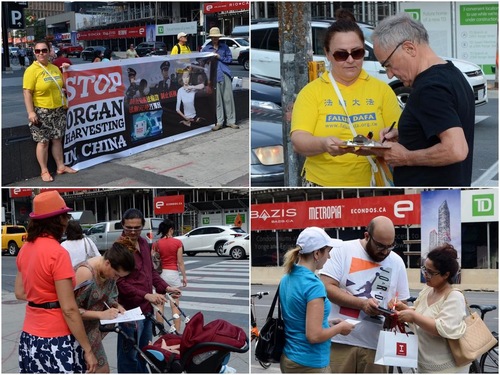 Praktisi Falun Gong mengumpulkan tanda tangan di sebuah persimpangan besar, Yonge & Eglinton.